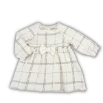 Abitino Coccodè a maniche lunghe in caldo jersey per neonata, con fantasia a quadri marrone chiaro e fiocco decorativo in vita. 1