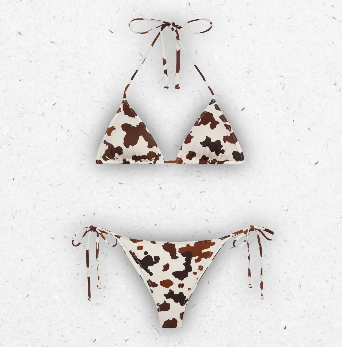 Costume da bagno due pezzi MC2 Saint Barth modello Leah Marielle con stampa animalier effetto pelle di mucca e slip con laccetti.