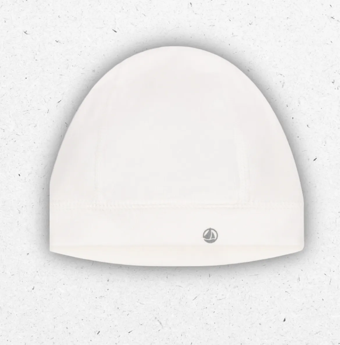 Cuffietta nascita per neonato Petit Bateau bianca in morbidissimo cotone a costine con bordo flessibile.