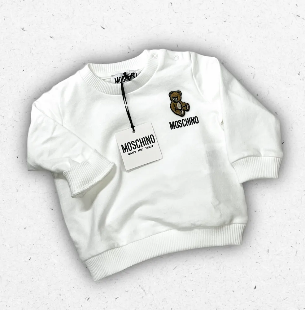 Felpa bianca da neonato Moschino Baby con stampa Teddy Bear e chiusura con bottoni automatici sulla spalla, disponibile da 3 mesi a 3 anni.