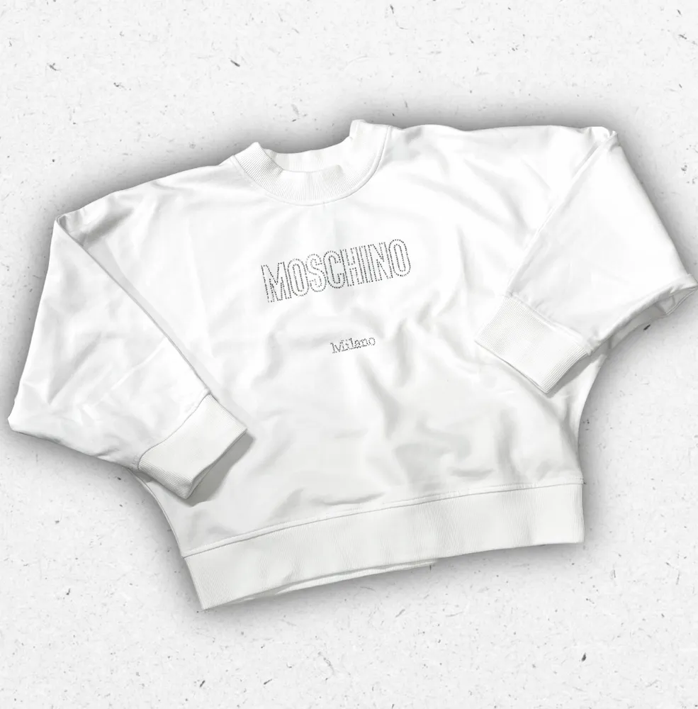 Felpa girocollo da ragazza Moschino Kids con stampa frontale logo e Teddy Bear iconico, in jersey di cotone morbido.