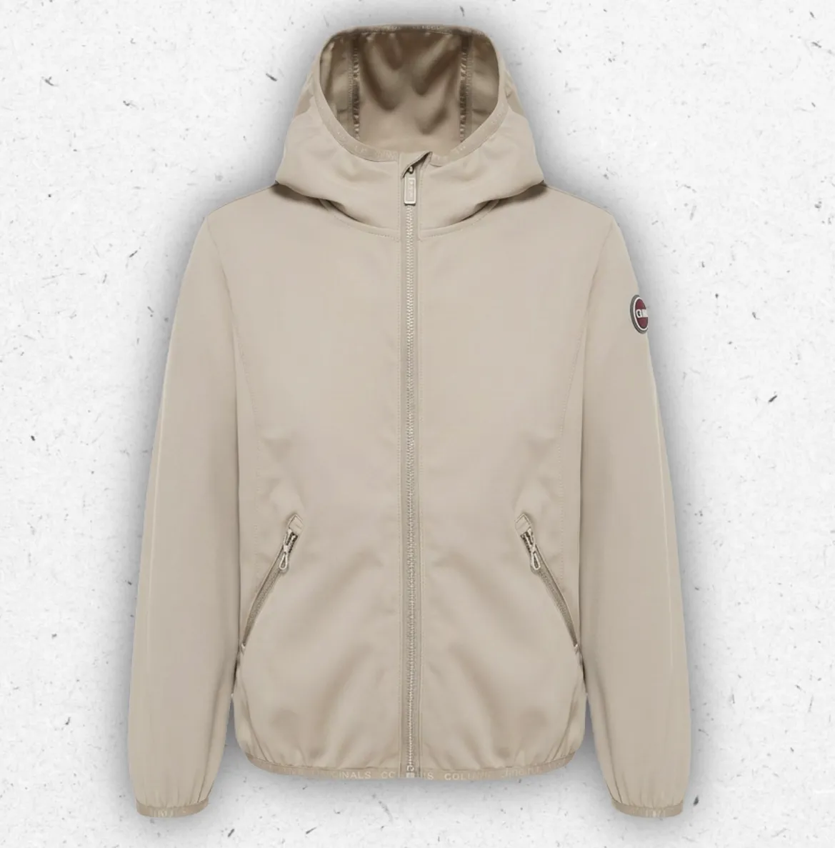 Giacca tecnica in softshell per bambina Colmar Originals disponibile in nero o canapa, con cappuccio fisso e logo sulla manica.