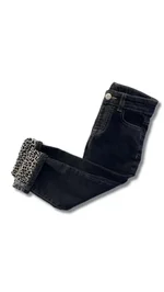 Jeans Please da bambina in colore Nero Denim scuro. Il modello presenta un risvolto con stampa animalier leopardata a contrasto. Disponibili dai 24 mesi ai 7 anni. 1