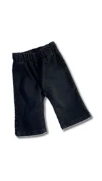 Pantaloni Liu Jo in denim stretch nero con strass e cintone elastico. 1
