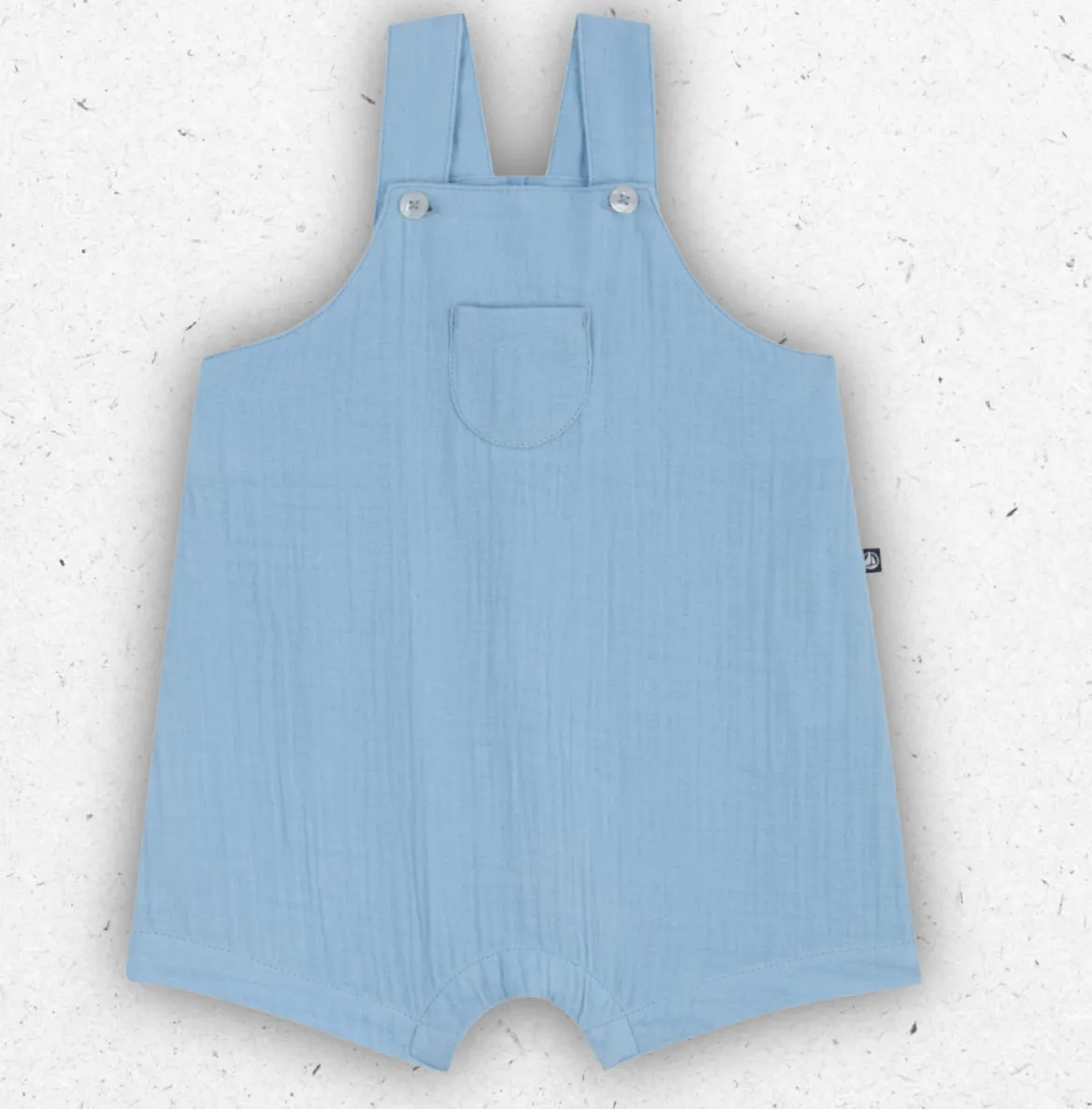 Salopette corta per neonato Petit Bateau in freschissima garza di cotone tinta unita con spalline regolabili e bottoni automatici.
