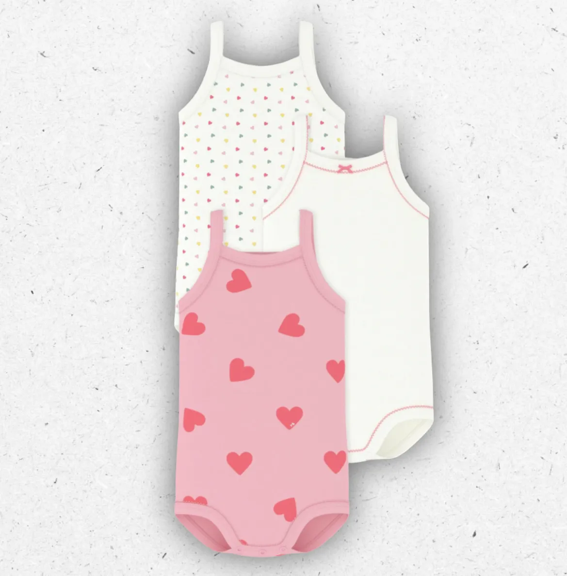 Set di tre body da neonata Petit Bateau senza maniche in cotone a costine con stampa a cuori e dettagli picot.