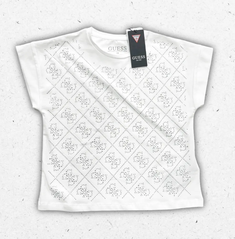 T-shirt bianca Guess da ragazza in puro cotone con logo iconico stampato sul petto.