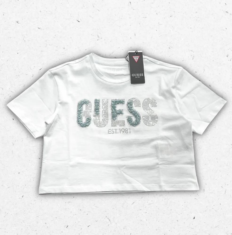 T-shirt Guess da ragazza in cotone con stampa logo iconica e vestibilità moderna.