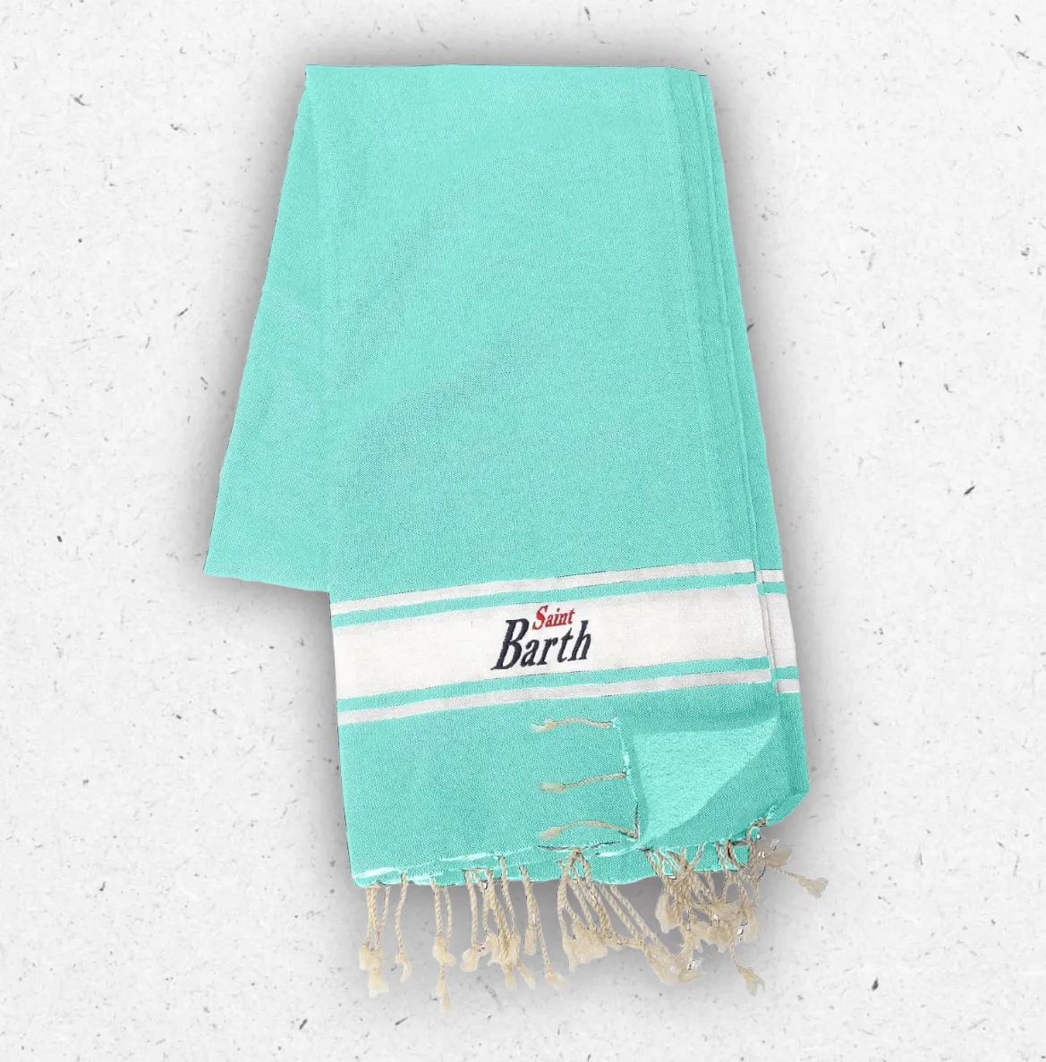 Telo mare MC2 Saint Barth modello Foutasponge in spugna di cotone azzurro turchese piegato, con fascia bianca, frange e logo ricamato.