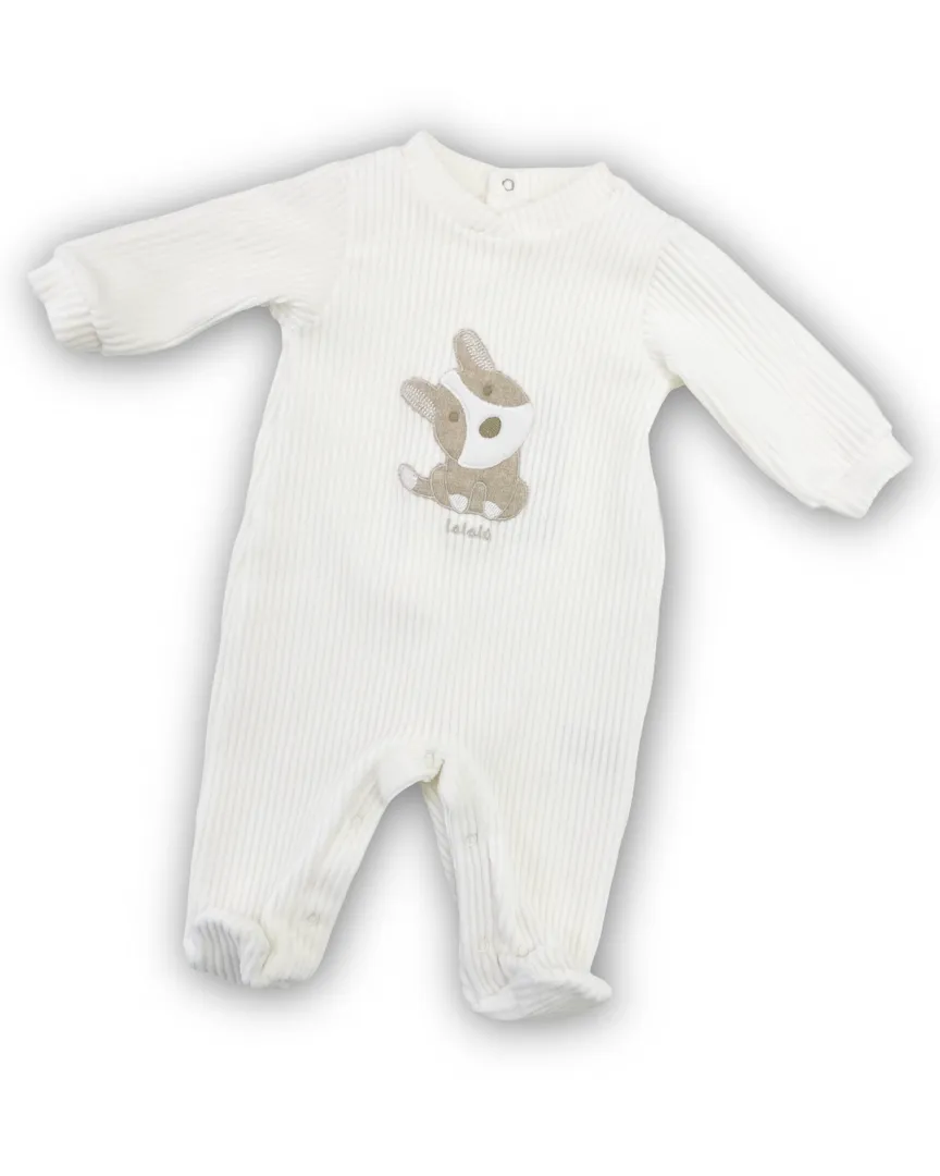 Tutina intera Lalalù per neonato o neonata in ciniglia a coste, di colore Bianco/Latte. Presenta un ricamo di un cagnolino.